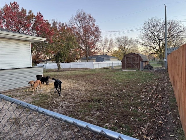 view of yard featuring a storage unit