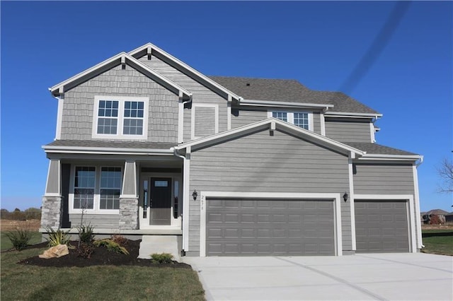 craftsman house featuring a porch and a garage