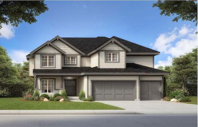 view of front of property featuring a garage and a front lawn