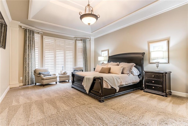 bedroom with a raised ceiling, carpet, and crown molding