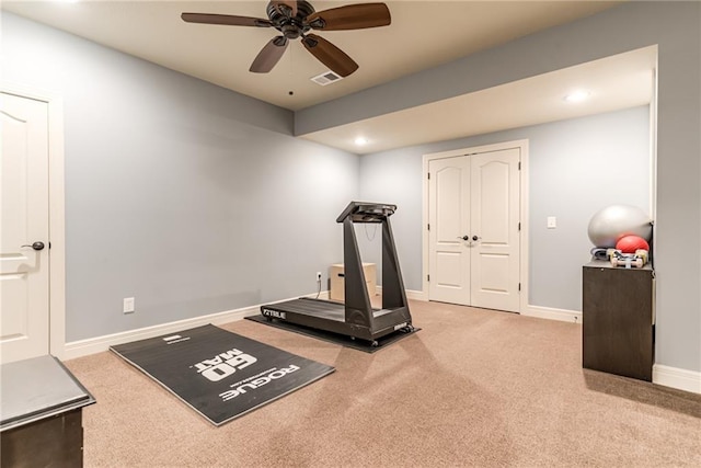 workout room featuring carpet flooring and ceiling fan