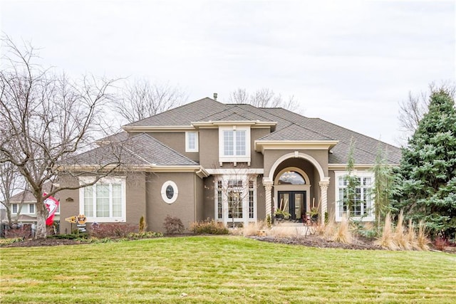 view of front of home with french doors and a front yard