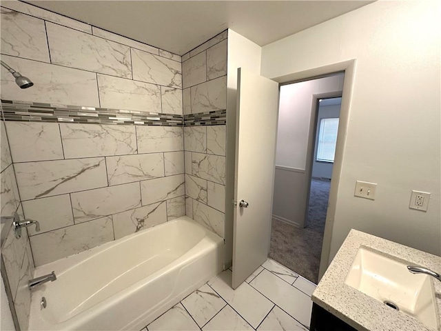 bathroom with vanity and tiled shower / bath combo