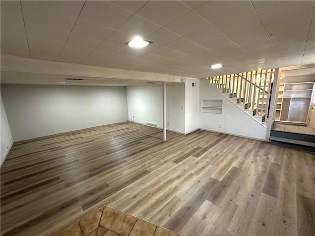 basement featuring hardwood / wood-style flooring