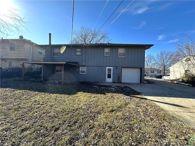 back of property with a garage