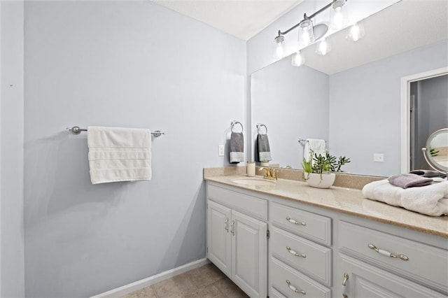 bathroom with tile patterned floors and vanity