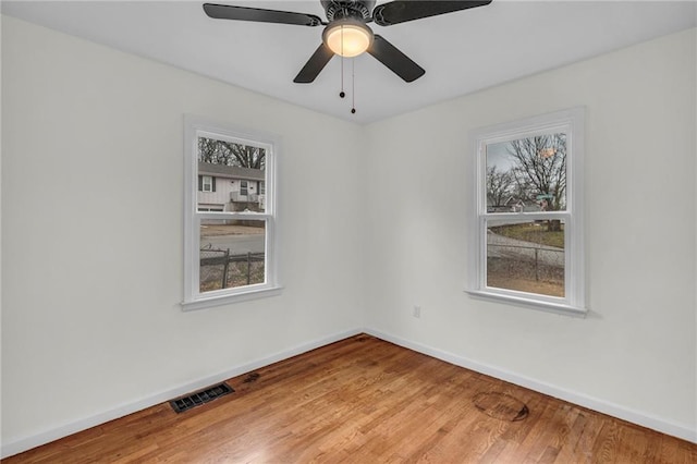 spare room featuring hardwood / wood-style floors