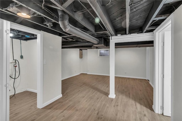 basement featuring hardwood / wood-style flooring