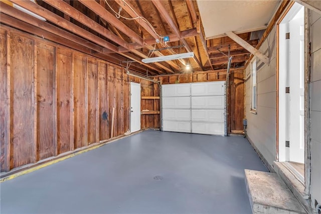 garage with wood walls