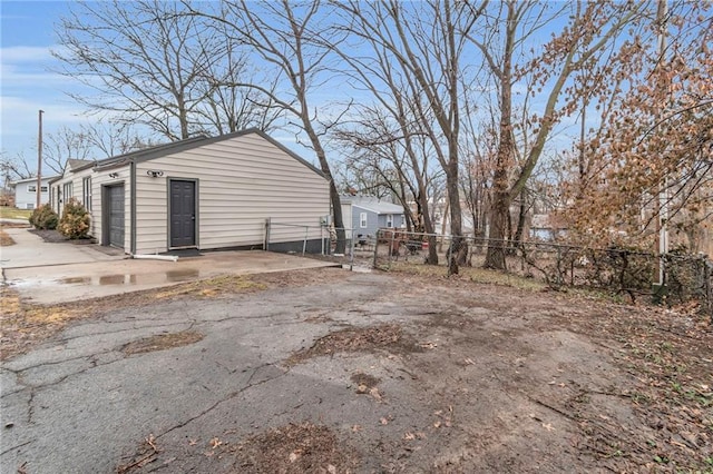 view of side of property with a garage