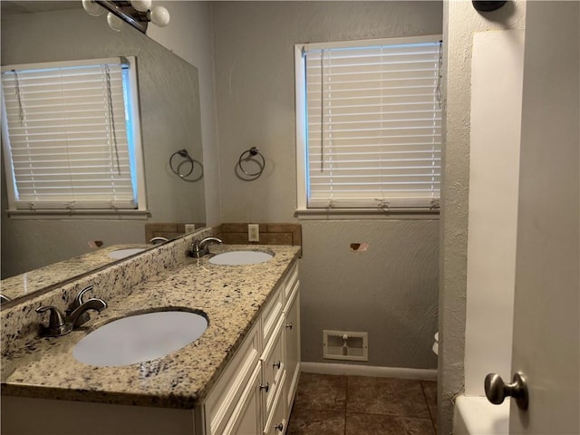 bathroom with vanity and tile patterned floors