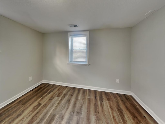 empty room featuring dark hardwood / wood-style floors