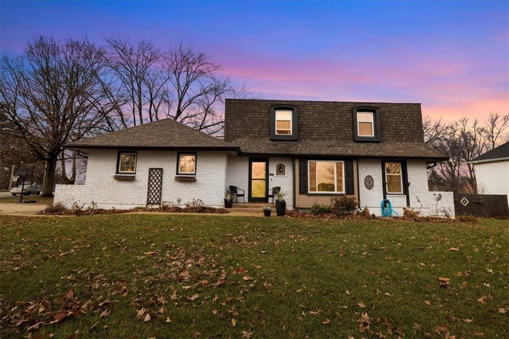 view of front of property with a yard