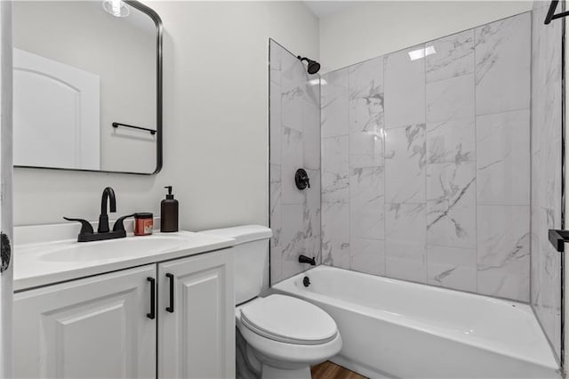 full bathroom with vanity, toilet, and tiled shower / bath