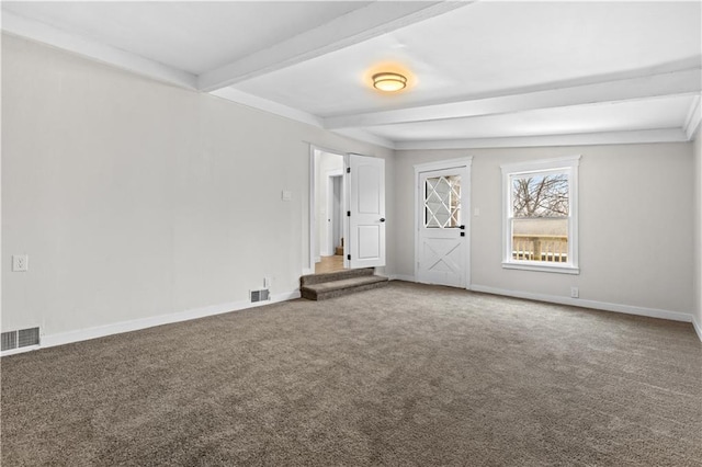 carpeted empty room featuring beam ceiling