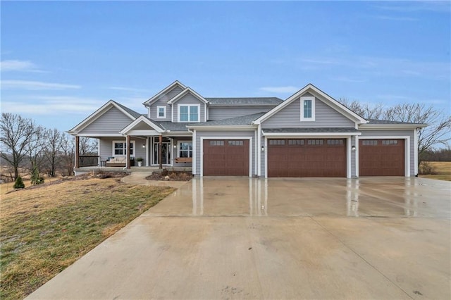 view of front of house featuring driveway, a front lawn, and a porch