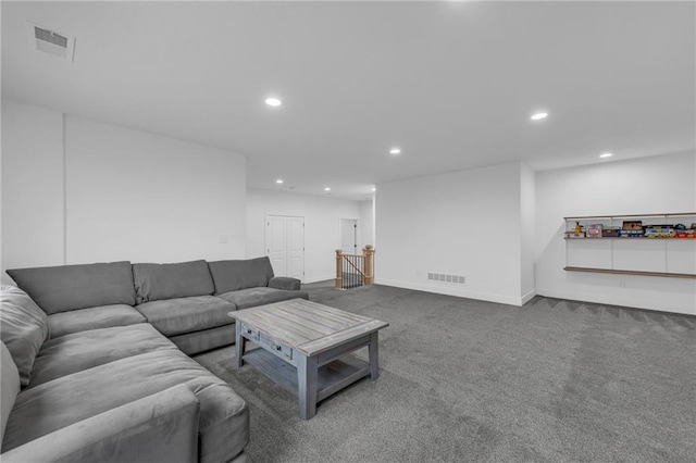 carpeted living room with recessed lighting, visible vents, and baseboards