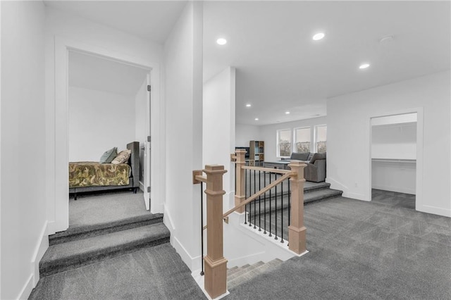 stairway with carpet, baseboards, and recessed lighting