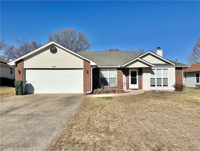 ranch-style home featuring a garage and a front yard