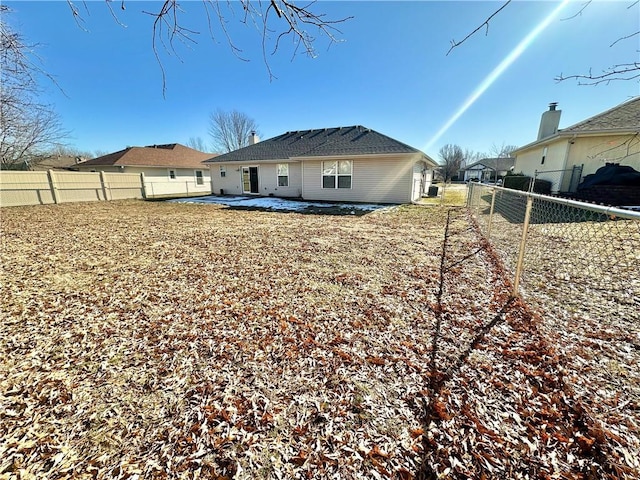 rear view of property featuring a patio