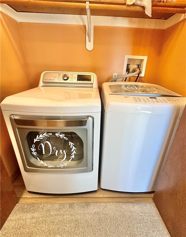 washroom with washer and clothes dryer