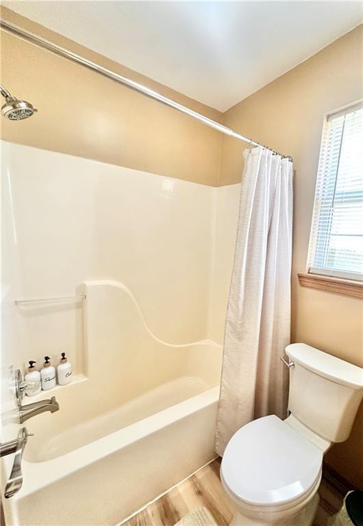 bathroom with toilet and hardwood / wood-style floors