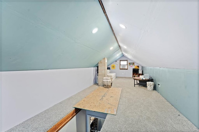 bonus room with lofted ceiling and carpet flooring