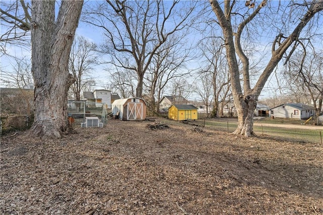 view of yard with a storage unit