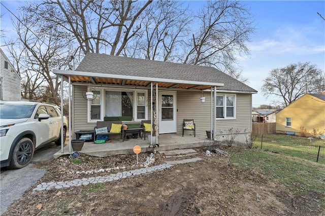 bungalow featuring a patio and a porch