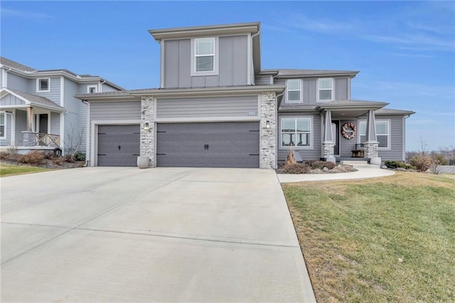 view of front of property featuring a garage and a front yard