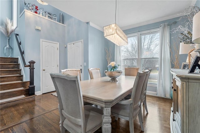 dining space featuring crown molding and dark hardwood / wood-style floors