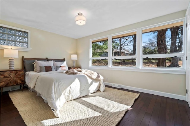 bedroom featuring dark hardwood / wood-style flooring