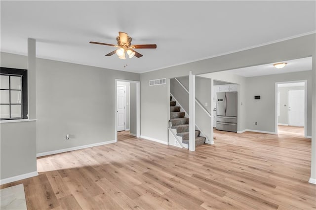 unfurnished room featuring light hardwood / wood-style floors and ceiling fan