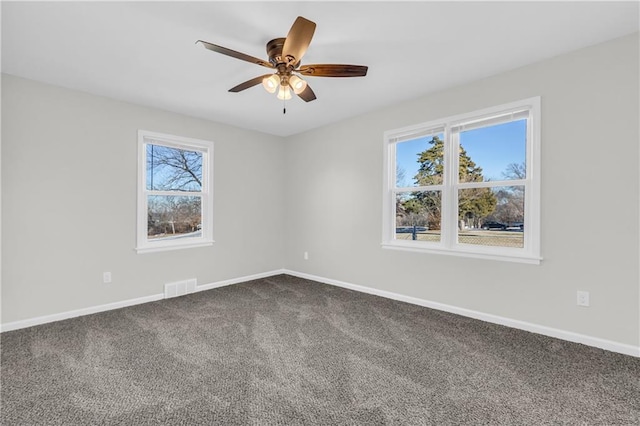 empty room featuring carpet floors and ceiling fan