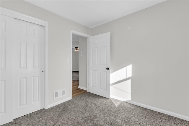 unfurnished bedroom featuring carpet flooring