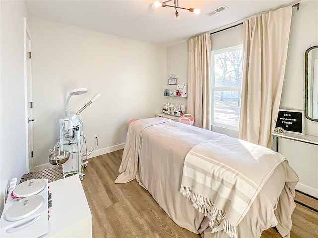 bedroom with light hardwood / wood-style floors