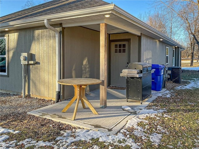 view of snow covered property entrance