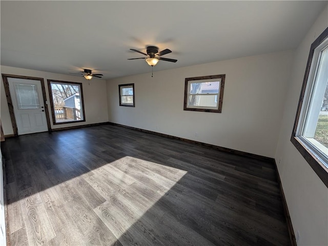 spare room featuring dark wood-type flooring