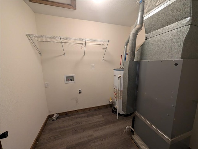 washroom featuring washer hookup, dark hardwood / wood-style floors, gas water heater, and electric dryer hookup