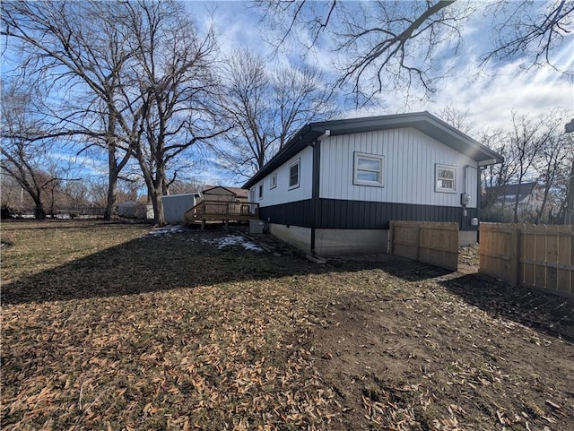 view of side of home featuring a deck