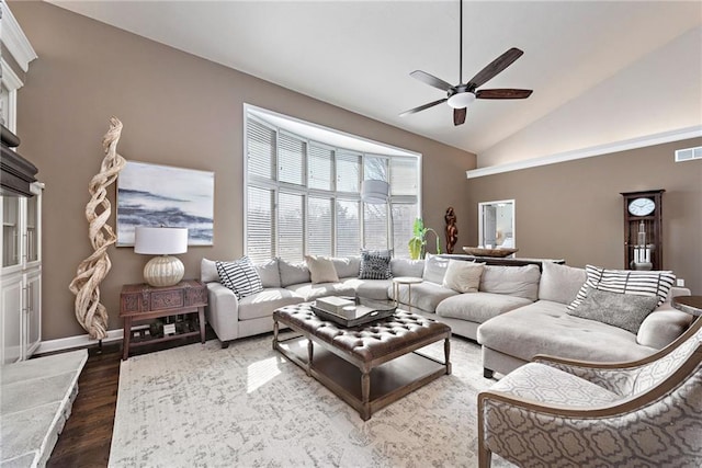 living room featuring high vaulted ceiling, dark wood-type flooring, and ceiling fan