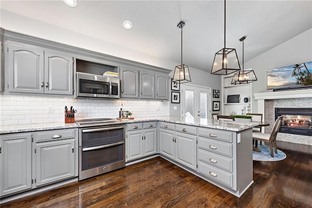 kitchen featuring hanging light fixtures, gray cabinets, stainless steel appliances, and french doors