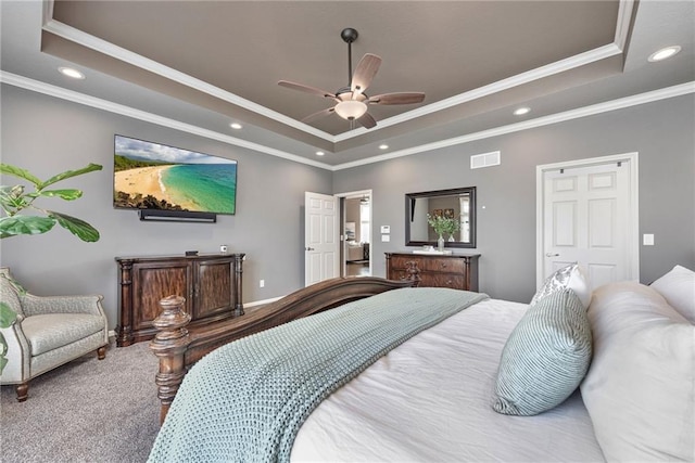 bedroom featuring a raised ceiling, ornamental molding, and carpet