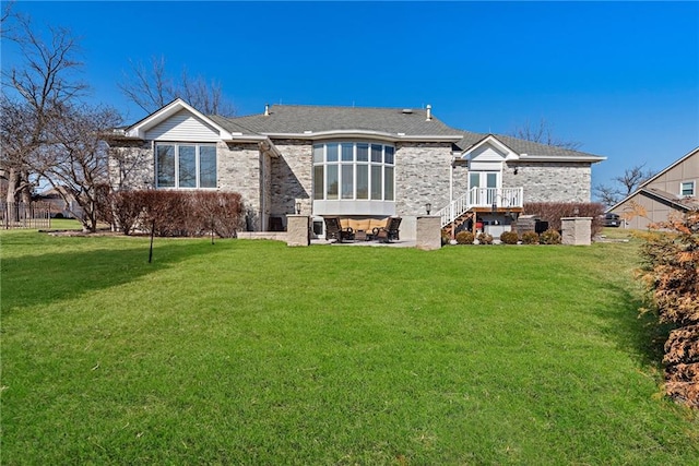 back of house featuring a yard and a patio area