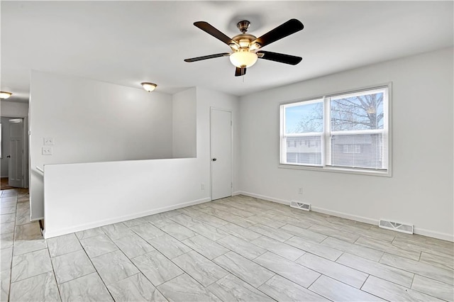 empty room featuring ceiling fan