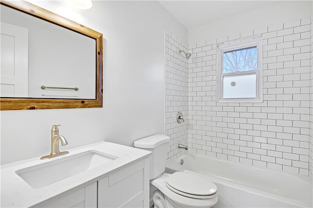 full bathroom with vanity, toilet, and tiled shower / bath