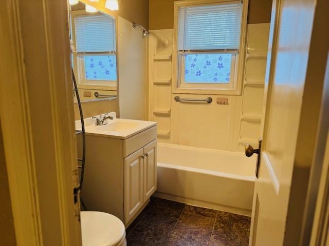 full bathroom with vanity, a wealth of natural light, bathing tub / shower combination, and toilet