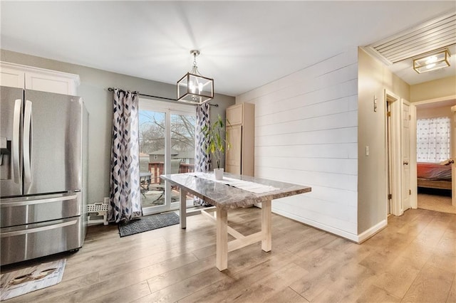 dining room with light hardwood / wood-style flooring