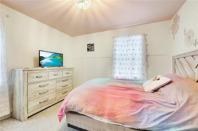 bedroom featuring light colored carpet