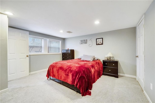 bedroom featuring light carpet